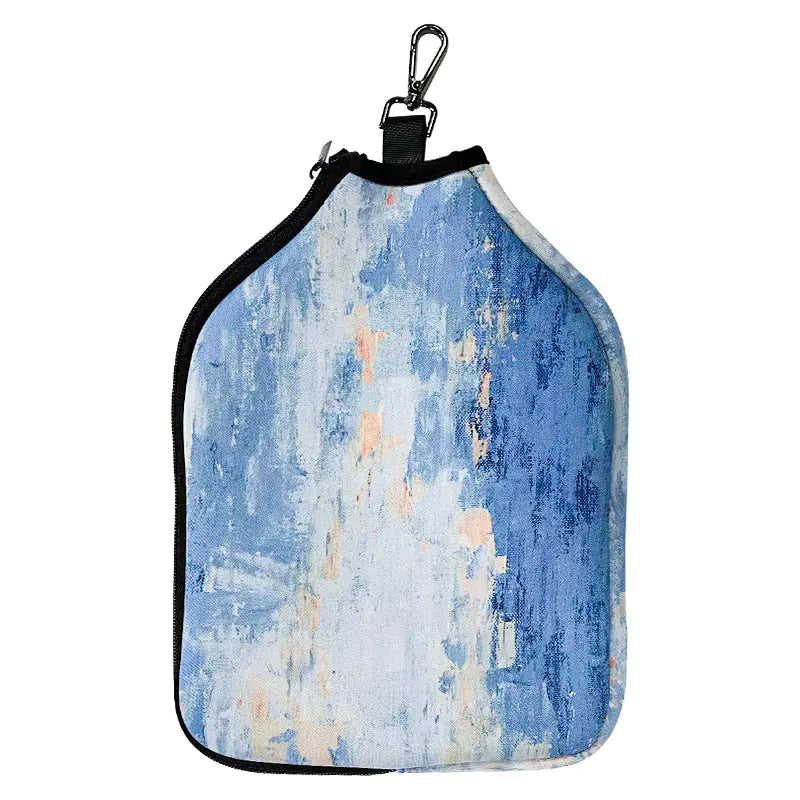 Pickleball paddle bag in multiple colors, standing upright on a court bench